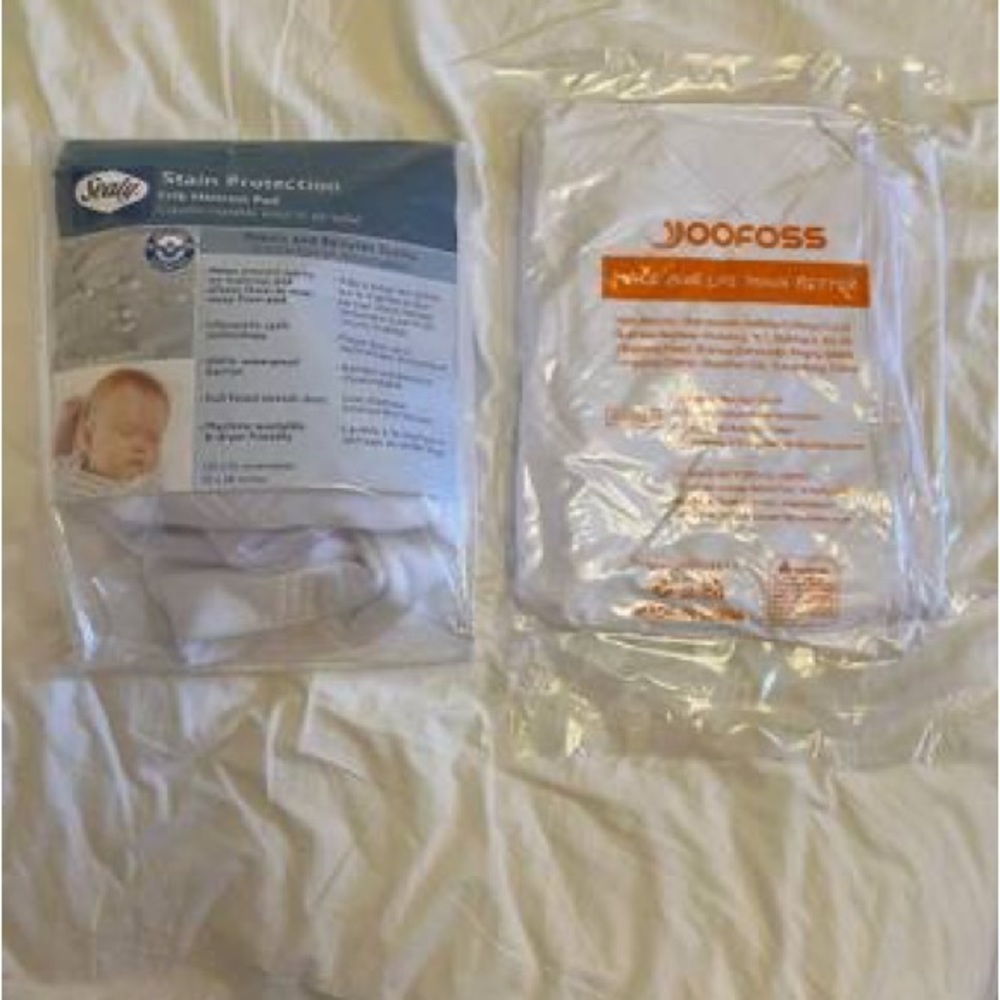 2 new crib mattress protector pads